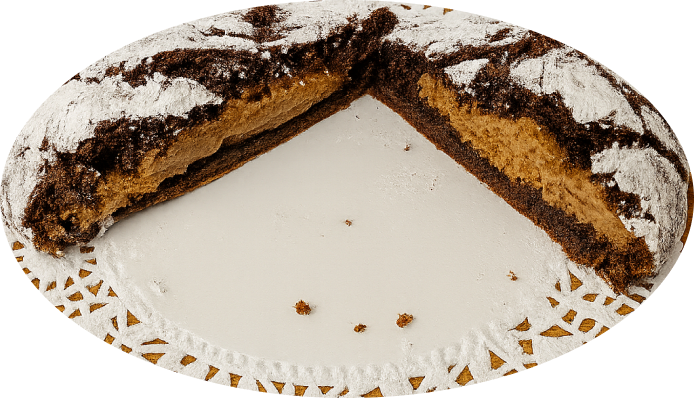 Helen’s Hidden Agenda A rich chocolate cookie stuffed with peanut butter whip and covered in powdered sugar